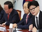 South Korea's ruling People Power Party leader Han Dong-hun, right, speaks during a meeting of the party's leadership at the National Assembly in Seoul, South Korea, 