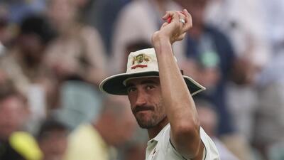 Australia's Mitchell Starc holds up the ball to celebrate a six-wicket haul during the day one of the second cricket Test against India at the Adelaide Oval. (AP)