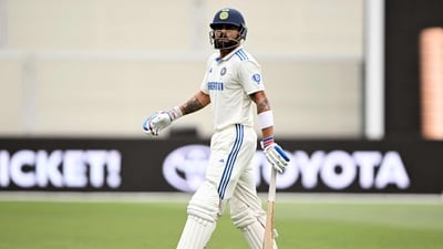 Virat Kohli walks off after being dismissed by Mitchell Starc at the Adelaide Oval. (AFP)