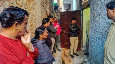 Police personnel and others at a house at Neb Sarai area where a middle-aged couple and their daughter were found dead. (PTI) Police personnel and others at a house at Neb Sarai area where a middle-aged couple and their daughter were found dead. (PTI)