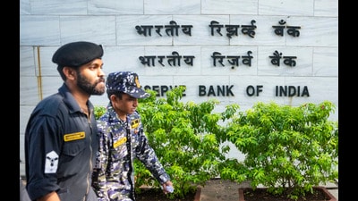 Mumbai: Security personnal outside the Reserve Bank of India headquarters, in Mumbai, Friday, Dec. 6, 2024. The RBI on Friday raised the inflation projection for current fiscal year to 4.8 per cent from 4.5 per cent with Governor Shaktikanta Das saying lingering food price pressures are likely to keep headline inflation elevated in the December quarter. (PTI Photo/Shashank Parade) (PTI) Mumbai: Security personnal outside the Reserve Bank of India headquarters, in Mumbai, Friday, Dec. 6, 2024. The RBI on Friday raised the inflation projection for current fiscal year to 4.8 per cent from 4.5 per cent with Governor Shaktikanta Das saying lingering food price pressures are likely to keep headline inflation elevated in the December quarter. (PTI Photo/Shashank Parade) (PTI)