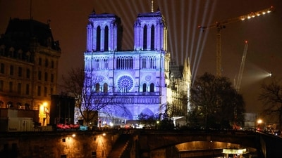 This photograph shows video mapping on the facade of Notre-Dame de Paris cathedral a few days before its reopening. (AFP) This photograph shows video mapping on the facade of Notre-Dame de Paris cathedral a few days before its reopening. (AFP)