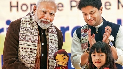 Prime Minister Narendra Modi being felicitated by a child in the presence of Union minister Jyotiraditya Scindia during the inauguration of the ‘Ashtalakshmi Mahotsav’ at the Bharat Mandapam, in New Delhi. (PTI)
