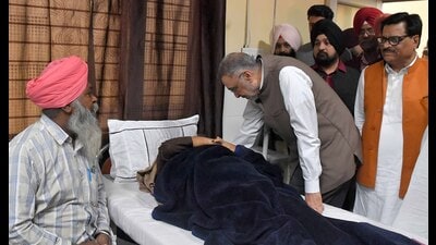 Punjab health minister Dr Balbir Singh interacts with a patient at a health centre in Ludhiana on Friday. (Manish/HT)