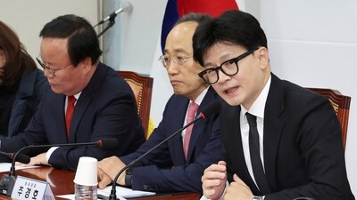 South Korea's ruling People Power Party leader Han Dong-hun, right, speaks during a meeting of the party's leadership at the National Assembly in Seoul, South Korea, (AP) South Korea's ruling People Power Party leader Han Dong-hun, right, speaks during a meeting of the party's leadership at the National Assembly in Seoul, South Korea, (AP)