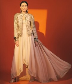 Karisma Kapoor dons an asymmetrical flowy ensemble and a statement jacket (Photo: Instagram)