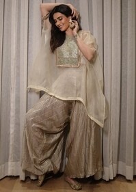 Karishma Kartik Tana chose a white tube top with a sheer cape top and printed palazzo bottoms (Photo: Instagram)