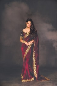 Outfit: SABE by Sanil & Beenu Makhija
Mohanan exudes elegance in a velvet saree from SABE by Sanil & Beenu Makhija. The deep maroon drape features a scalloped border intricately hand-embroidered with zardozi work. Complementing the saree is a matching blouse with a sweetheart neckline, adorned with delicate floral buttis. Her look is further elevated with exquisite jewellery from Anana Outfit: SABE by Sanil & Beenu Makhija
Mohanan exudes elegance in a velvet saree from SABE by Sanil & Beenu Makhija. The deep maroon drape features a scalloped border intricately hand-embroidered with zardozi work. Complementing the saree is a matching blouse with a sweetheart neckline, adorned with delicate floral buttis. Her look is further elevated with exquisite jewellery from Anana