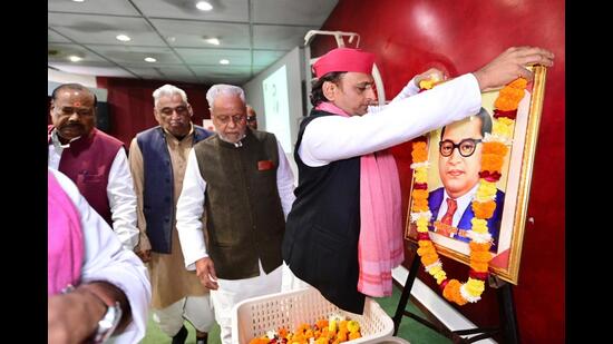 Akhilesh Yadav paying tribute to Bharat Ratna Baba Saheb Bhimrao Ambedkar on his death anniversary at SP headquarters in Lucknow on Friday. (HT PHOTO)