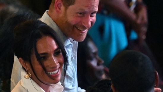 Britain's Prince Harry (back), Duke of Sussex, and his wife Meghan Markle (L) greet Colombia's vice-President Francia Marquez. (AFP)
