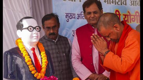 Chief minister Yogi Adityanath pays tribute to BR Ambedkar on his death anniversary, in Lucknow, Friday. (PTI Photo)