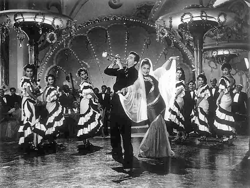 The tramp would reappear, in darkening shades — adrift, disenfranchised, on the run and wrongly accused of violent crimes — through the ’50s, in films such as Shree 420 (above). The tramp would reappear, in darkening shades — adrift, disenfranchised, on the run and wrongly accused of violent crimes — through the ’50s, in films such as Shree 420 (above).