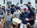 Anti-riot police officials produce Narain Singh Chaura, who opened fire at Sukhbir Singh Badal 