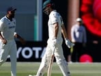 Australia's Mitchell Marsh, right, walks off the field. Australia's Mitchell Marsh, right, walks off the field.