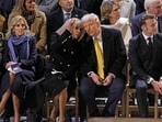 President Emmanuel Macron's wife Brigitte Macron (CL) talks with US President-elect Donald Trump (CR) as they sit alongside the daughter of US President Joe Biden, Ashley Biden (L), First Lady of the United States Jill Biden.