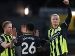 Manchester City's Erling Haaland celebrates scoring their first goal with Manchester City's Kevin De Bruyne and Savinho Action Images via Reuters/Paul Childs