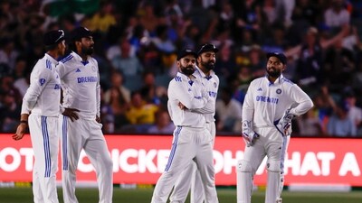 Indian players wait after the floodlights went off during the day one of the second cricket test match. (AP) Indian players wait after the floodlights went off during the day one of the second cricket test match. (AP)