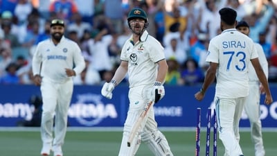 Australia's Travis Head, centre, reacts after he is bowled out by India's Mohammed Siraj. (AP) Australia's Travis Head, centre, reacts after he is bowled out by India's Mohammed Siraj. (AP)