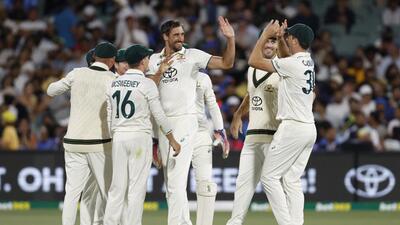 Australian team celebrates the dismissal of Shubman Gill on Day 2 of Adelaide Test on Saturday. (AP) Australian team celebrates the dismissal of Shubman Gill on Day 2 of Adelaide Test on Saturday. (AP)