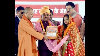 CM Yogi Adityanath felicitating a newly married couple in Varanasi on Saturday (Sourced) CM Yogi Adityanath felicitating a newly married couple in Varanasi on Saturday (Sourced)