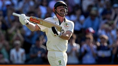 Travis Head with a rock-the-baby celebration after his century vs India at the Adelaide Oval. (AFP) Travis Head with a rock-the-baby celebration after his century vs India at the Adelaide Oval. (AFP)