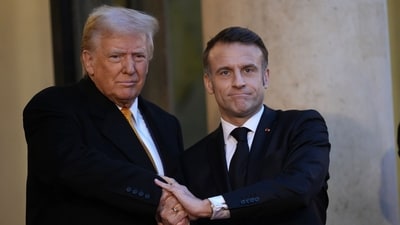Emmanuel Macron, France's President, right, welcomes US president-elect Donald Trump, before a meeting at The Elysee Presidential Palace, in Paris, France on Saturday. (Bloomberg) (Bloomberg) Emmanuel Macron, France's President, right, welcomes US president-elect Donald Trump, before a meeting at The Elysee Presidential Palace, in Paris, France on Saturday. (Bloomberg) (Bloomberg)