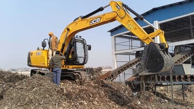 Garbage processing work underway at the dump site in Tajpur Road area of Ludhiana on Saturday. (HT Photo) Garbage processing work underway at the dump site in Tajpur Road area of Ludhiana on Saturday. (HT Photo)