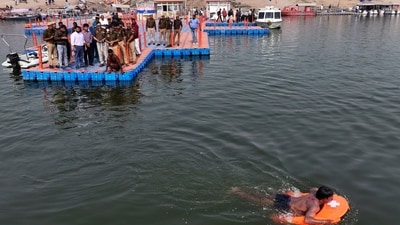 Police officials test a remote-controlled lifebuoy on the Ganges river, in preparation in Prayagraj on December 3, 2024. ( (AP Photo/Rajesh Kumar Singh))