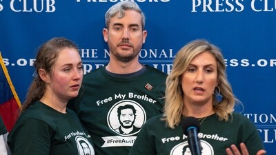Meagan Malone speaks about their brother Austin Tice, a journalist who was kidnapped in Syria, as Jacob Tice, center, and his wife Cassie Fastabend listen, Friday, Dec. 6, 2024, as the family continues to push for his release during a news conference at the National Press Club in Washington. (AP Photo/Jacquelyn Martin) (AP) Meagan Malone speaks about their brother Austin Tice, a journalist who was kidnapped in Syria, as Jacob Tice, center, and his wife Cassie Fastabend listen, Friday, Dec. 6, 2024, as the family continues to push for his release during a news conference at the National Press Club in Washington. (AP Photo/Jacquelyn Martin) (AP)