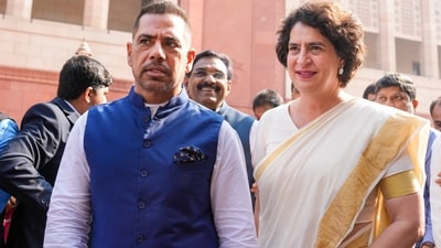 Congress MP Priyanka Gandhi Vadra with her husband Robert Vadra during the ongoing Winter session of Parliament, in New Delhi on November 28. (PTI) (PTI) Congress MP Priyanka Gandhi Vadra with her husband Robert Vadra during the ongoing Winter session of Parliament, in New Delhi on November 28. (PTI) (PTI)