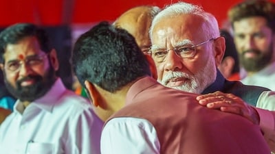 Prime Minister Narendra Modi with the newly sworn Maharashtra Chief Minister Devendra Fadnavis, left, and deputy chief minister Eknath Shinde (background left) during the swearing-in ceremony, in Mumbai, Thursday. (PTI) Prime Minister Narendra Modi with the newly sworn Maharashtra Chief Minister Devendra Fadnavis, left, and deputy chief minister Eknath Shinde (background left) during the swearing-in ceremony, in Mumbai, Thursday. (PTI)