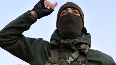 An anti-government fighter gestures in the city of Hama after forces captured the central Syrian city,&nbsp; (AFP)