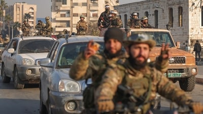 Syrian opposition fighters ride along the streets in the aftermath of the opposition's takeover of Hama, Syria. (AP) Syrian opposition fighters ride along the streets in the aftermath of the opposition's takeover of Hama, Syria. (AP)