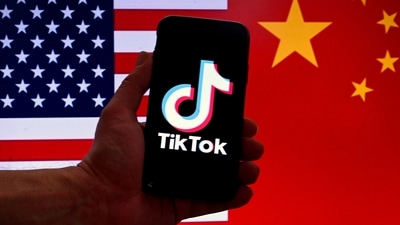 TikTok logo is displayed on the screen of an iPhone in front of a US flag and Chinese flag background in Washington, DC. (AFP) TikTok logo is displayed on the screen of an iPhone in front of a US flag and Chinese flag background in Washington, DC. (AFP)
