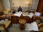 After rebel forces officially secured the capital city of Damascus, people celebrated the fall of dictator and president Bashar al-Assad's regime of 24 years. A Syrian opposition fighter is seen here sitting inside an office at the presidential palace after the ouster.