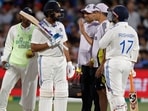 Members of the team support staff attend to India's captain Rohit Sharma. (AP Photo/James Elsby) Members of the team support staff attend to India's captain Rohit Sharma. (AP Photo/James Elsby)