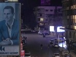 A giant portrait of Syrian president Bashar Assad sets on a building, as empty streets seen in Damascus, Syria.
