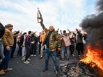 People celebrate at Umayyad Square in Damascus.