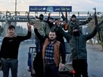 Syrian rebel fighters celebrate at the entrance of Homs province early on December 8, 2024, after rebel forces entered Syria's third city overnight. Hayat Tahrir al-Sham (HTS) and allied anti-government factions have pressed a lightning offensive since November 27, sweeping swathes of the country from government control, including major cities Aleppo, Hama and Homs.