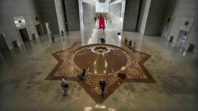 Residents were seen walking through the halls of the palace on Sunday after the Islamist Hayat Tahrir al-Sham (HTS) group challenged Assad's rule and made a lightning advance taking over major cities such as Aleppo, Homs and eventually Damascus (AP)