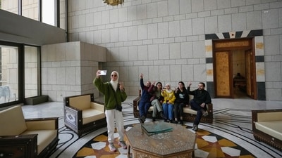 Several people posed and took family pictures celebrating the historic moment after the country had seen 13 years of civil war under Assad's regime. (AP)