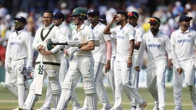 Australia's Usman Khawaja (2nd L) and batting partner Nathan McSweeney in Adelaide on Sunday. (AP) Australia's Usman Khawaja (2nd L) and batting partner Nathan McSweeney in Adelaide on Sunday. (AP)