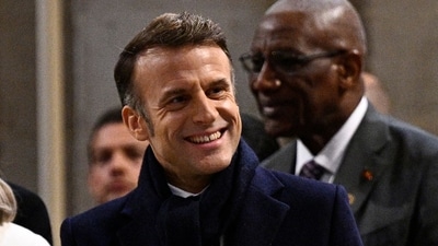 France's President Emmanuel Macron gestures as he arrives to attend the first mass for the public in which Archbishop of Paris will lead prayers to consecrate the new main alter, at the Notre-Dame de Paris cathedral, in Paris, on December 8, 2024. (AFP) France's President Emmanuel Macron gestures as he arrives to attend the first mass for the public in which Archbishop of Paris will lead prayers to consecrate the new main alter, at the Notre-Dame de Paris cathedral, in Paris, on December 8, 2024. (AFP)