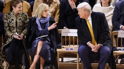 Jill Biden  and Trump were waiting for French First Lady Brigitte Macron to assume the seat that parted the duo during the reopening ceremony. (Reuters)