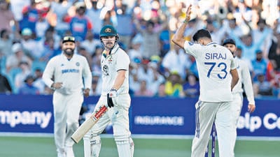 India's Mohammed Siraj, right, celebrates after the dismissal of Australia's Travis Head, centre, during the day two of the second cricket test match between Australia and India at the Adelaide Oval in Adelaide, on Saturday. (AP) India's Mohammed Siraj, right, celebrates after the dismissal of Australia's Travis Head, centre, during the day two of the second cricket test match between Australia and India at the Adelaide Oval in Adelaide, on Saturday. (AP)