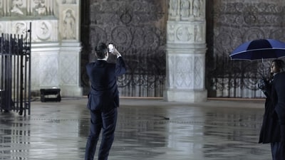 Tesla and SpaceX CEO Elon Musk takes a photograph as he arrives outside Notre-Dame Cathedral ahead of a ceremony to mark the re-opening of the landmark cathedral. (AFP) Tesla and SpaceX CEO Elon Musk takes a photograph as he arrives outside Notre-Dame Cathedral ahead of a ceremony to mark the re-opening of the landmark cathedral. (AFP)