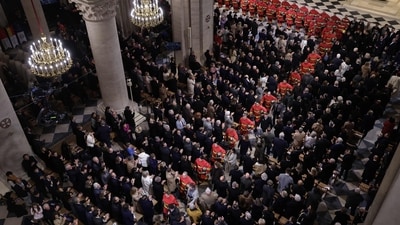French Firefighters parade during a ceremony to mark the re-opening of the landmark Notre-Dame Cathedral, in central Paris. (AFP) French Firefighters parade during a ceremony to mark the re-opening of the landmark Notre-Dame Cathedral, in central Paris. (AFP)