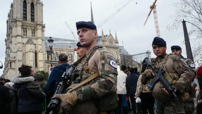 French military of the Sentinelle Operation patrol through the security perimetre around the Notre-Dame de Paris cathedral. (AFP) French military of the Sentinelle Operation patrol through the security perimetre around the Notre-Dame de Paris cathedral. (AFP)