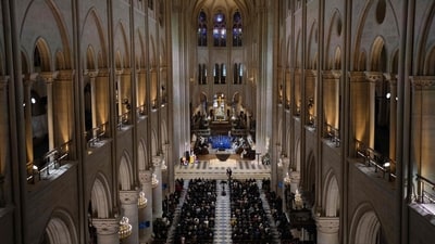 Guests sit as they attend a ceremony to mark the re-opening of the landmark Notre-Dame Cathedral. (AFP) Guests sit as they attend a ceremony to mark the re-opening of the landmark Notre-Dame Cathedral. (AFP)