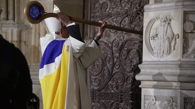 Archbishop of Paris, Bishop Ulrich, knocks on the door of Notre-Dame Cathedral. (AFP) Archbishop of Paris, Bishop Ulrich, knocks on the door of Notre-Dame Cathedral. (AFP)